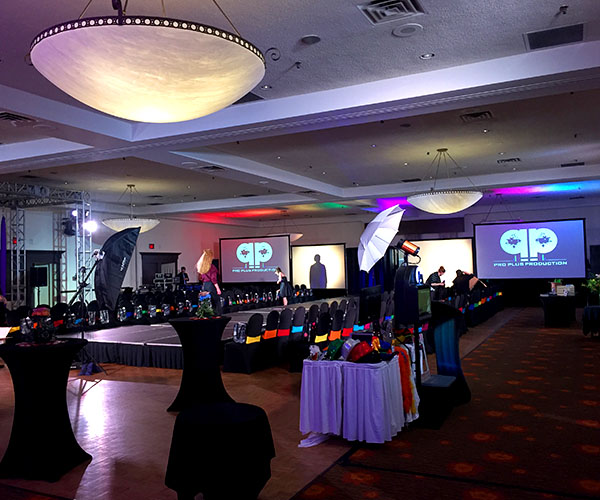 Fashion show fundraising gala with video projector screens and stage wash lights